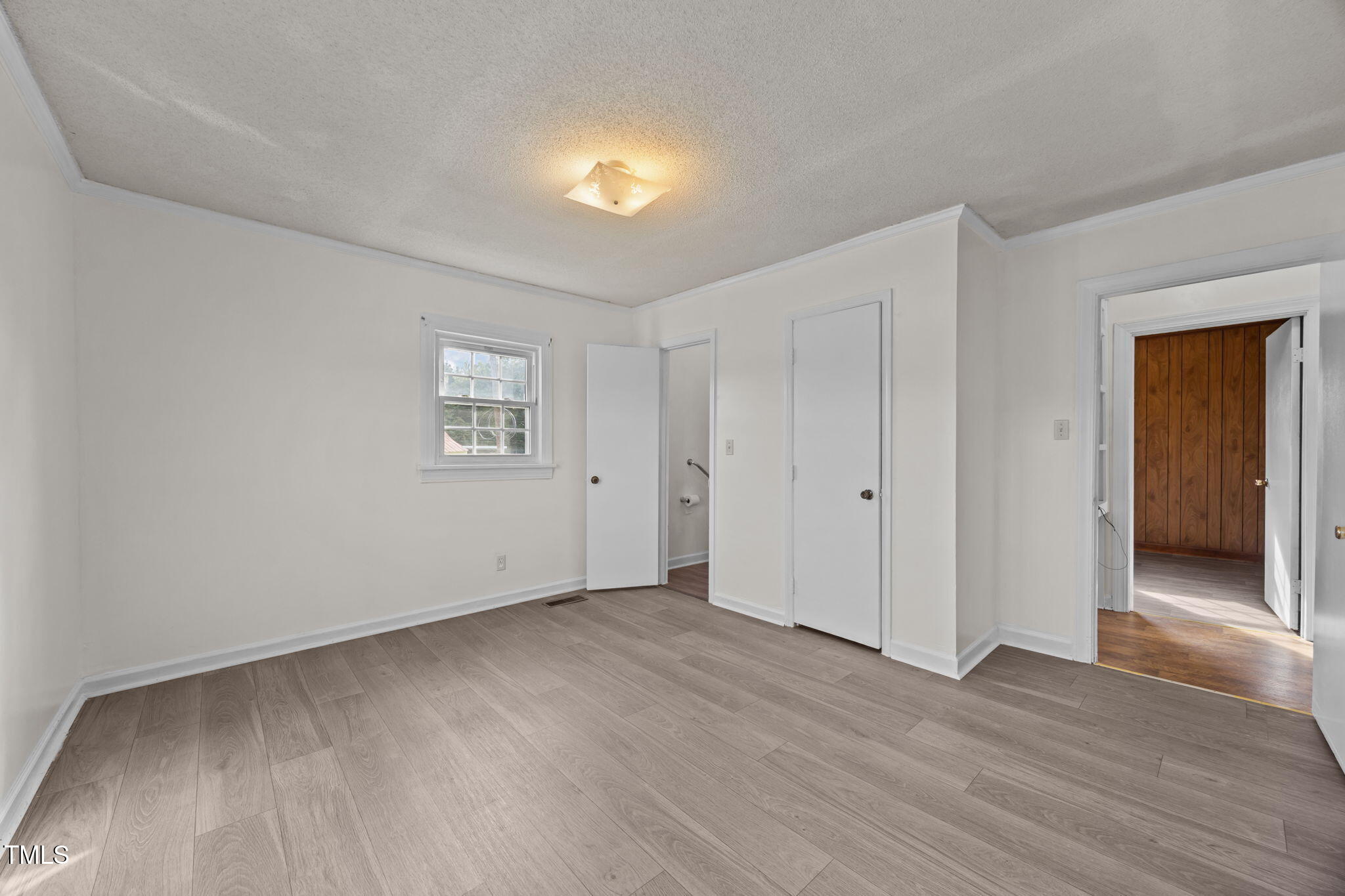 6590 Hassell Road Robersonville, NC 27871 - Photo 15 of 42 a view of an empty room with wooden floor and a window