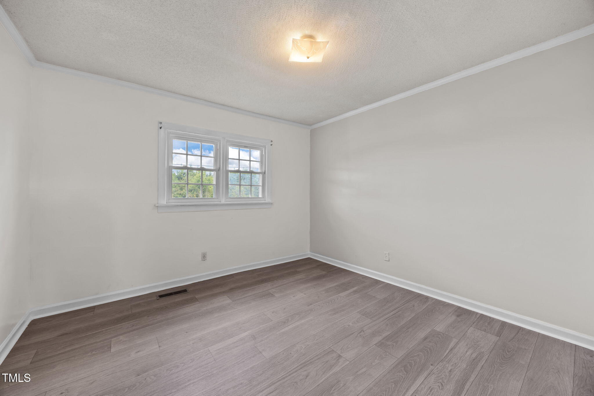 6590 Hassell Road Robersonville, NC 27871 - Photo 19 of 42 an empty room with a window