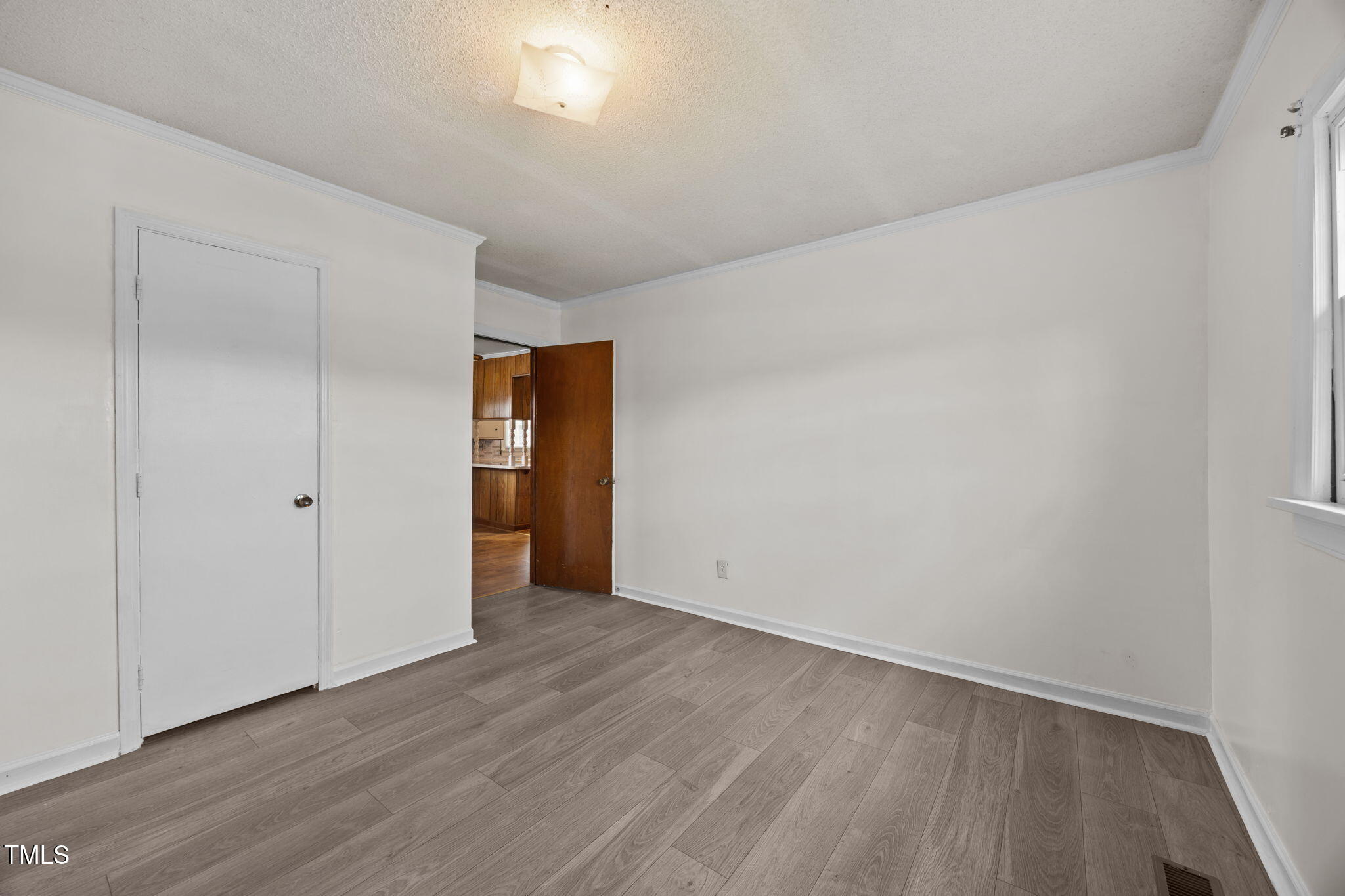 6590 Hassell Road Robersonville, NC 27871 - Photo 20 of 42 a view of an empty room with wooden floor and closet