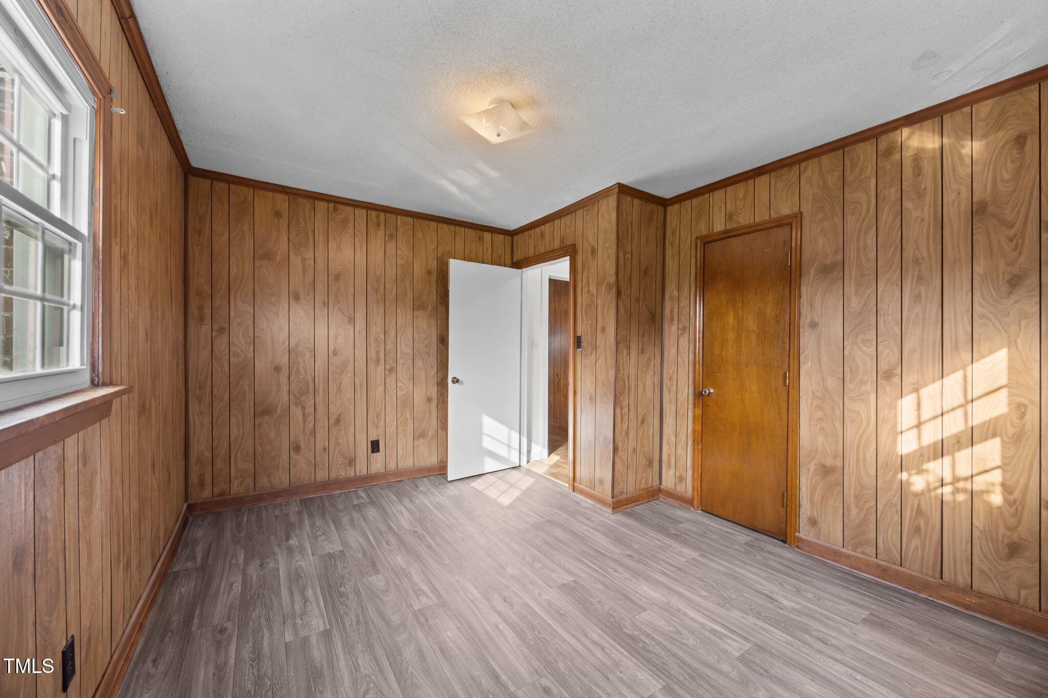6590 Hassell Road Robersonville, NC 27871 - Photo 23 of 42 a view of an empty room with wooden floor and a window