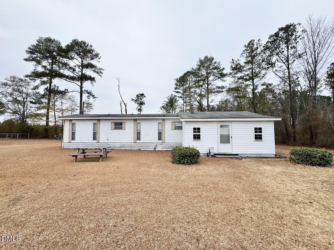 6590 Hassell Road Robersonville, NC 27871 - Photo 35 of 42 a view of a house with a patio and a yard