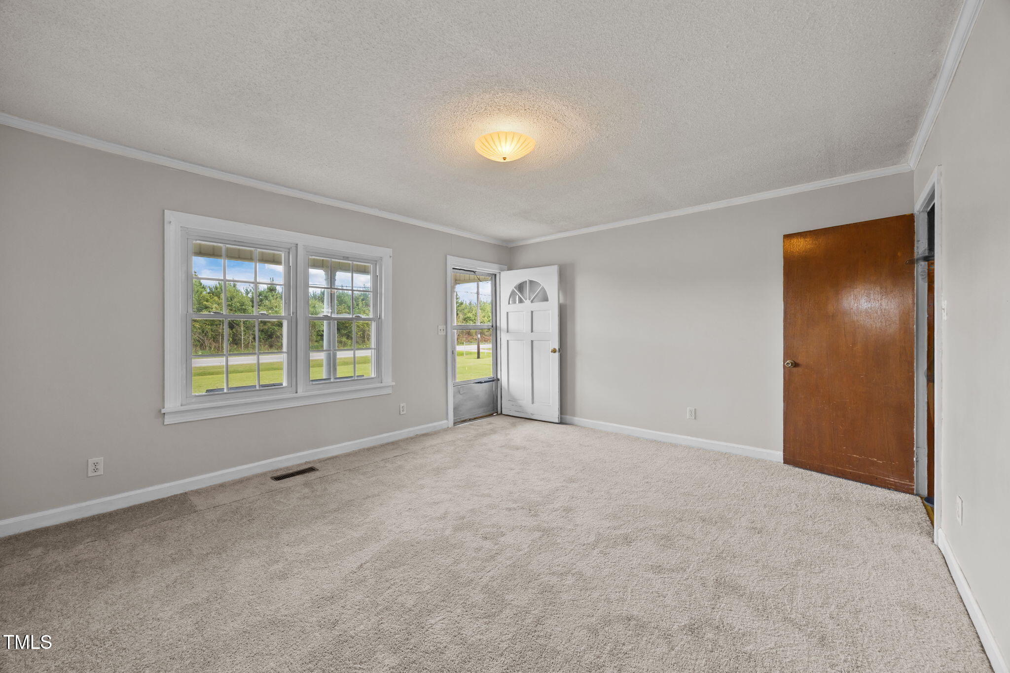 6590 Hassell Road Robersonville, NC 27871 - Photo 5 of 42 an empty room with windows and closet