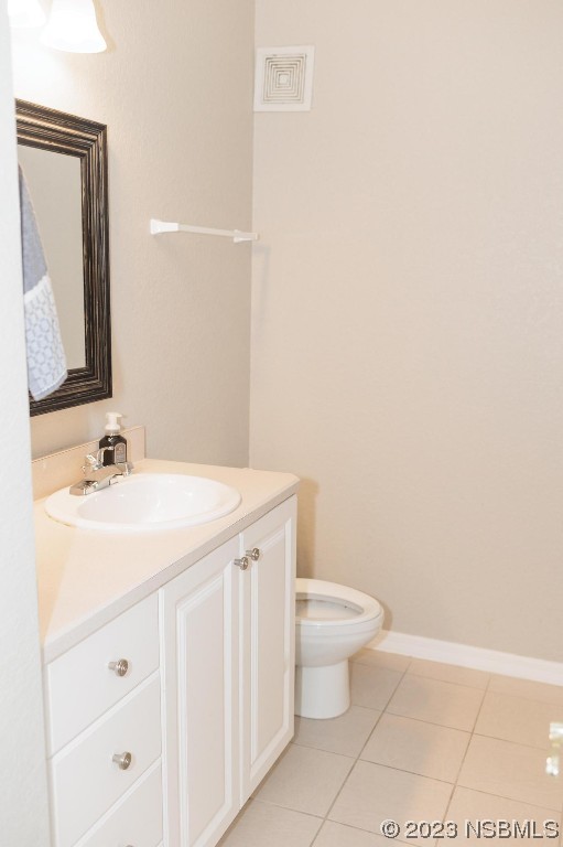 830 Airport Road, Unit 305 Port Orange, FL 32128 - Photo 15 of 27 a bathroom with a sink a toilet and mirror