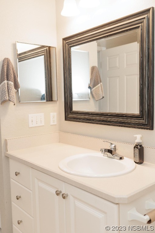 830 Airport Road, Unit 305 Port Orange, FL 32128 - Photo 16 of 27 a bathroom with a sink and a mirror