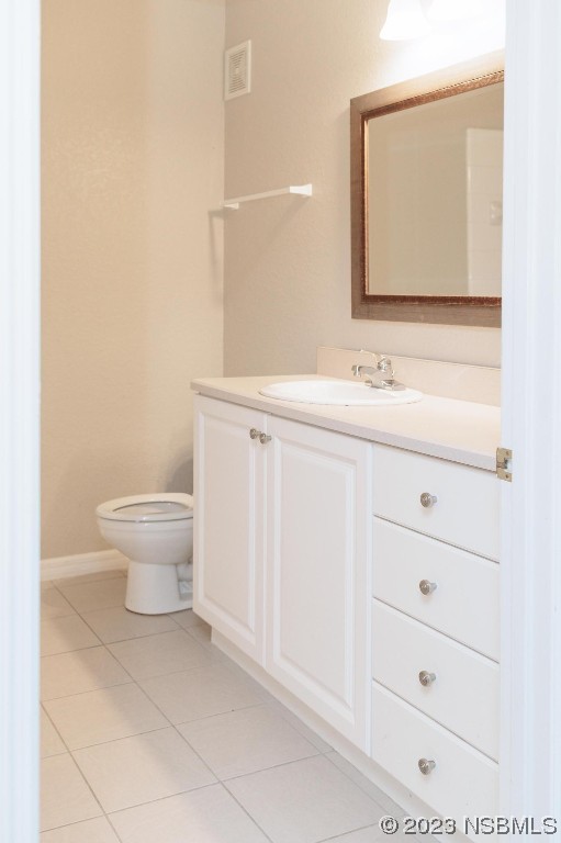 830 Airport Road, Unit 305 Port Orange, FL 32128 - Photo 21 of 27 a bathroom with a sink a toilet and mirror