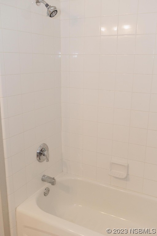 830 Airport Road, Unit 305 Port Orange, FL 32128 - Photo 23 of 27 a bathroom with a bathtub