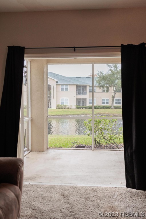 830 Airport Road, Unit 305 Port Orange, FL 32128 - Photo 24 of 27 a front view of a house with a yard and a garage