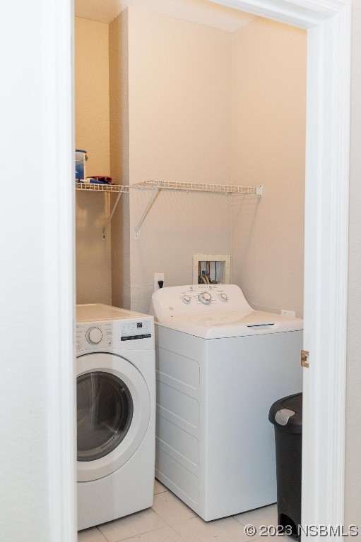 830 Airport Road, Unit 305 Port Orange, FL 32128 - Photo 25 of 27 a utility room with dryer and washer