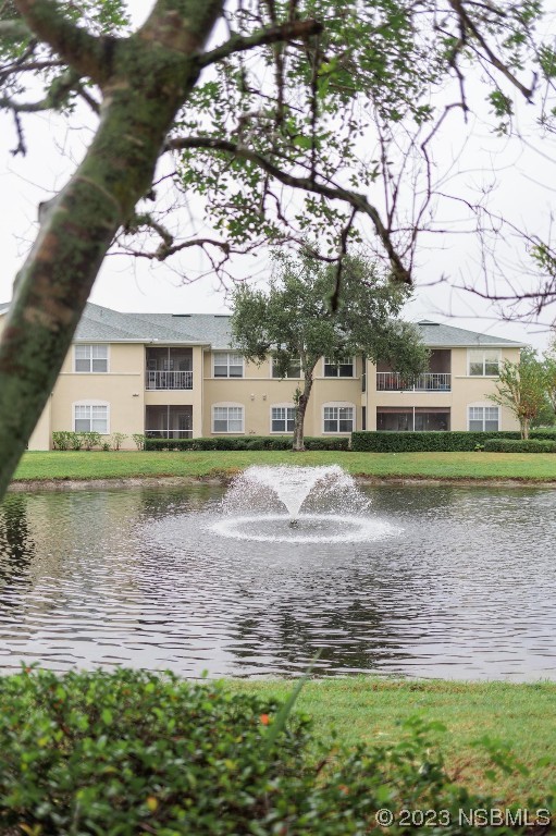 830 Airport Road, Unit 305 Port Orange, FL 32128 - Photo 26 of 27 a view of a house with a yard