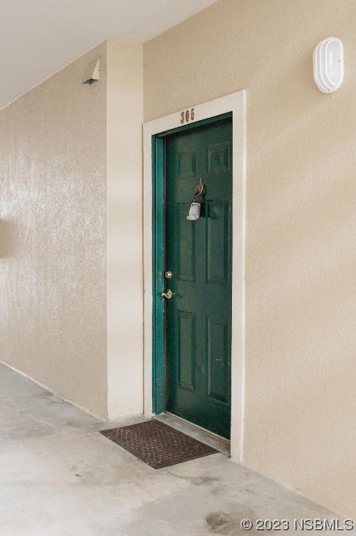 830 Airport Road, Unit 305 Port Orange, FL 32128 - Photo 3 of 27 a view of a bathroom from a hallway