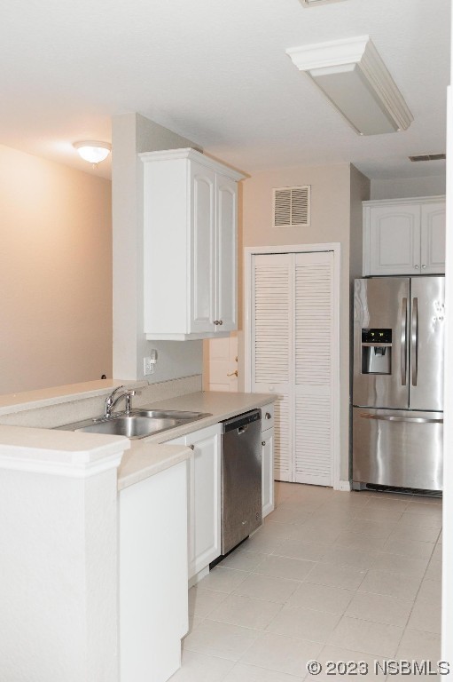 830 Airport Road, Unit 305 Port Orange, FL 32128 - Photo 6 of 27 a kitchen with stainless steel appliances granite countertop a sink and a refrigerator