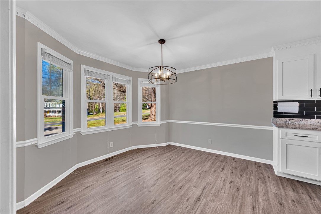 1509 Crestview Road Easley, SC 29642 - Photo 6 of 31 This bright and airy room features ample natural light and a stylish overhead fixture.