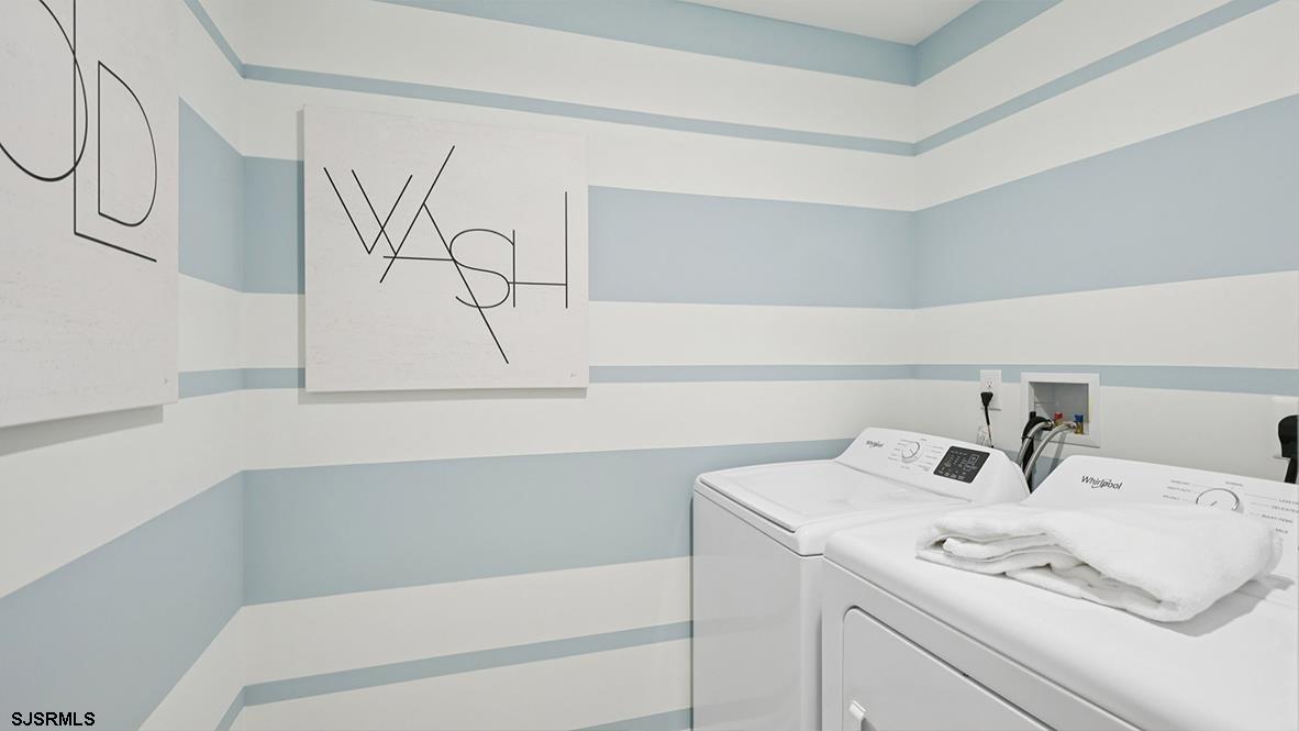 603 Scotty Boulevard, Unit 1403 Rio Grande, NJ 08242 - Photo 28 of 41 a bathroom with a sink and a mirror