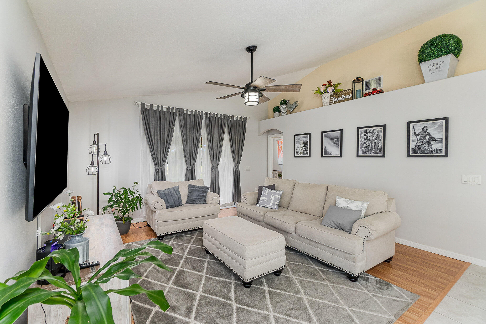 6914 Renshaw Drive Melbourne, FL 32940 - Photo 11 of 27 a living room with furniture and a flat screen tv