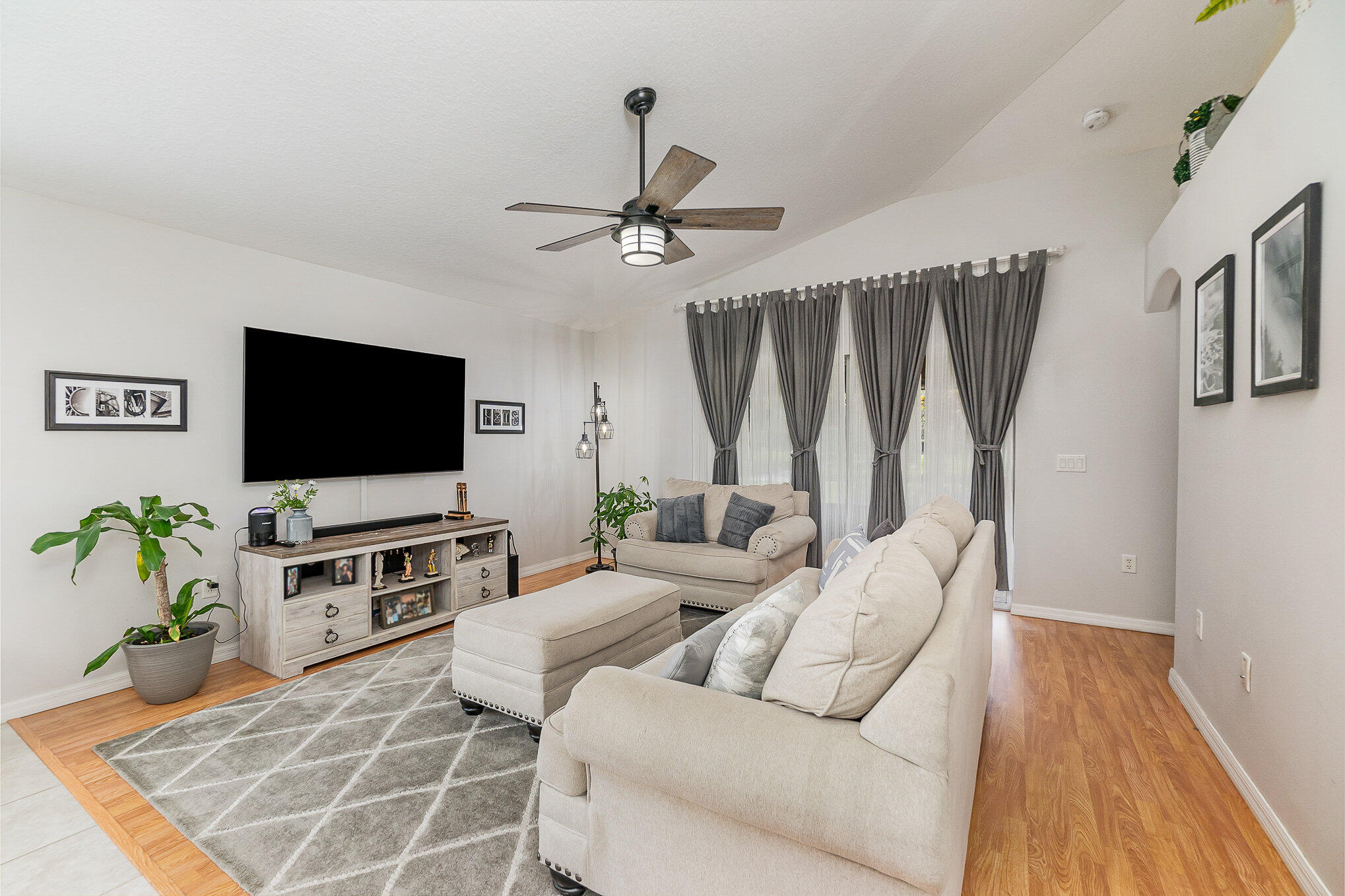 6914 Renshaw Drive Melbourne, FL 32940 - Photo 12 of 27 a living room with furniture and a flat screen tv