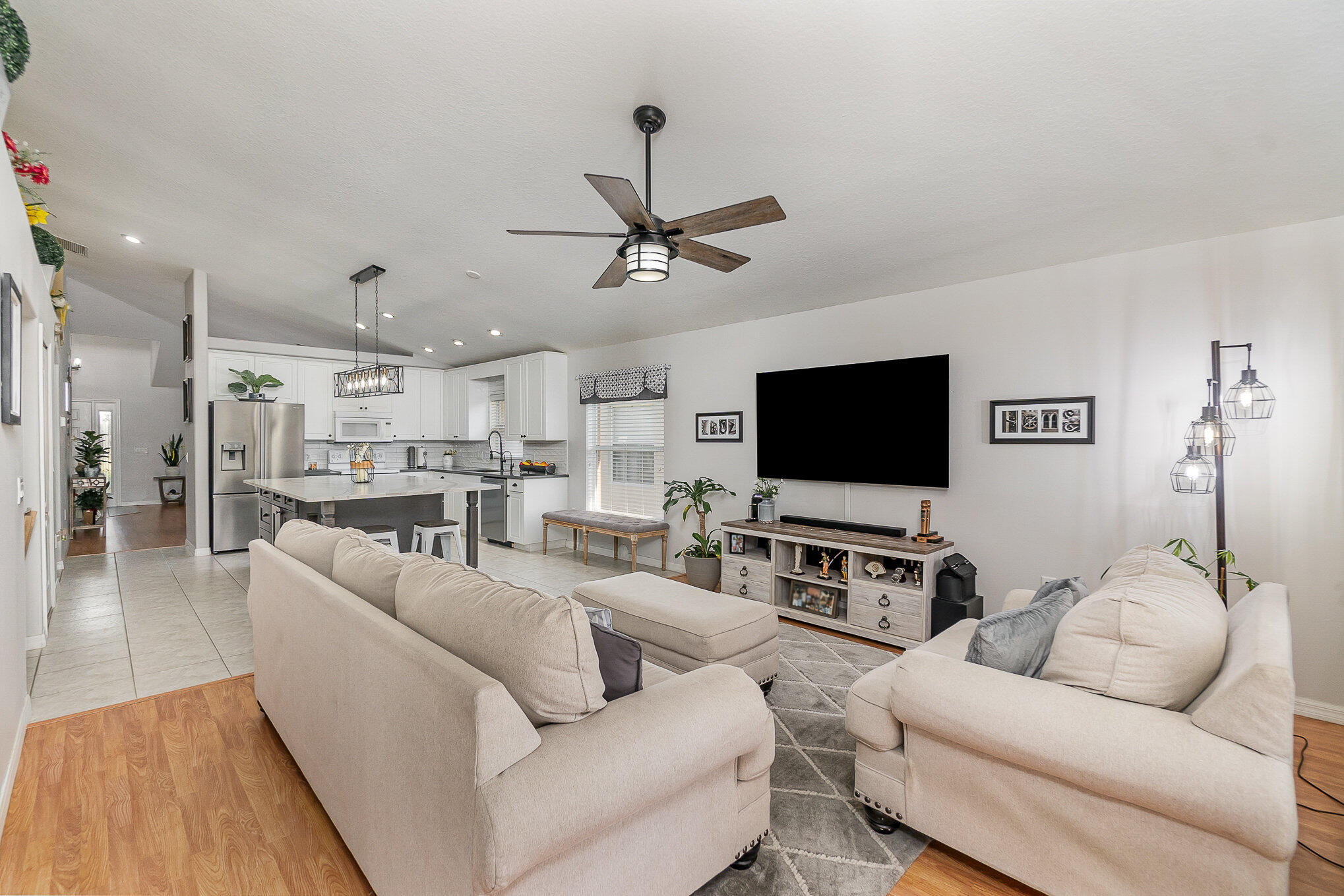 6914 Renshaw Drive Melbourne, FL 32940 - Photo 13 of 27 a living room with furniture and a flat screen tv