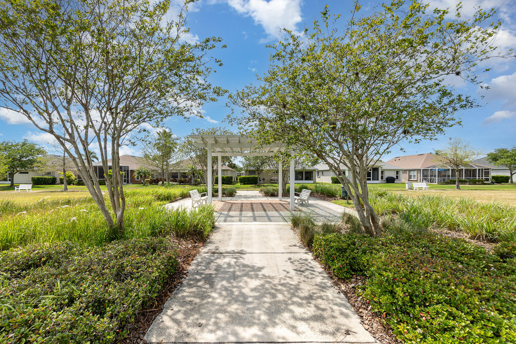 6914 Renshaw Drive Melbourne, FL 32940 - Photo 25 of 27 a view of a garden with trees