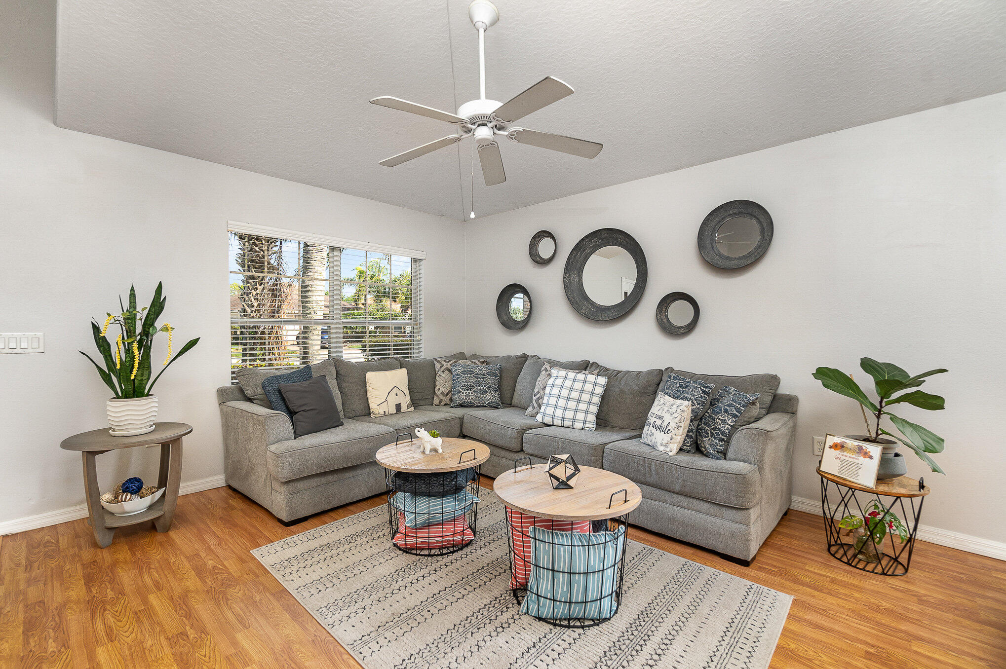 6914 Renshaw Drive Melbourne, FL 32940 - Photo 4 of 27 a living room with furniture and wooden floor