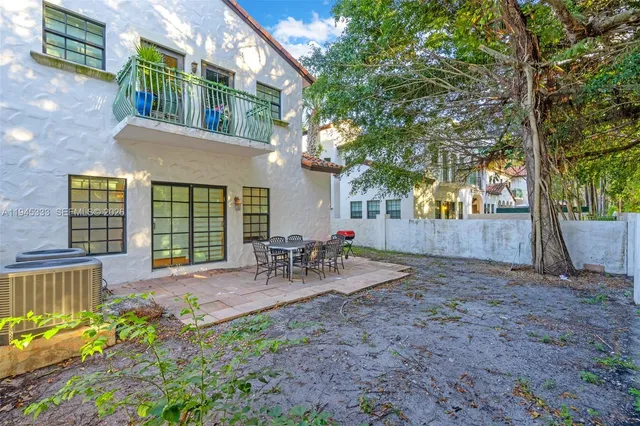an aerial view of residential building with outdoor space and swimming pool