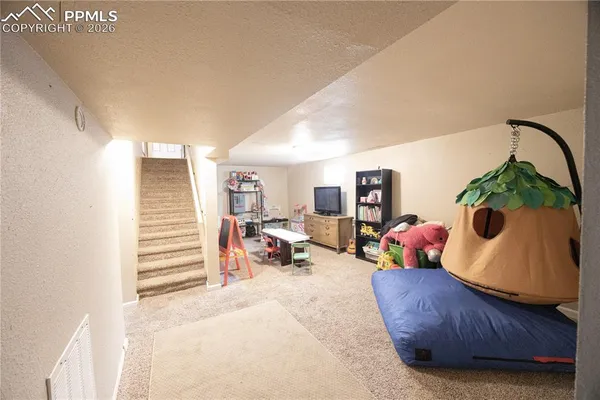 a living room with furniture and a couch