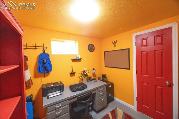 a bedroom with a bed and cupboard