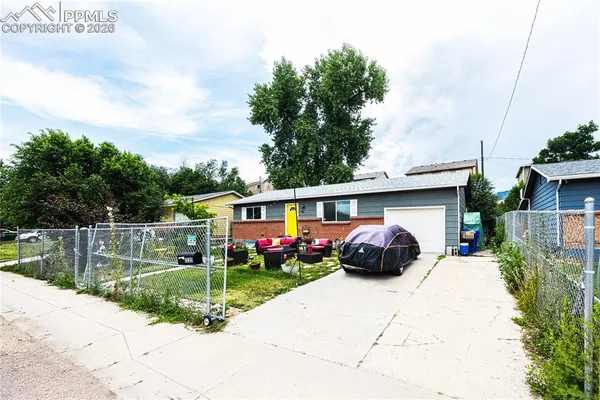 a view of a car parked in front of a house