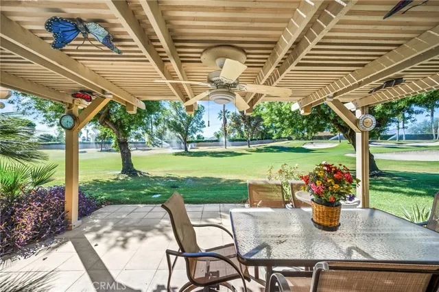 a view of a patio with a table and chairs
