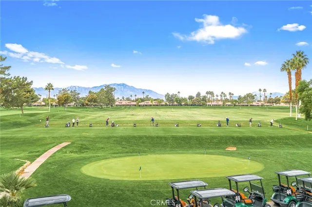 a view of a golf course with a lake view