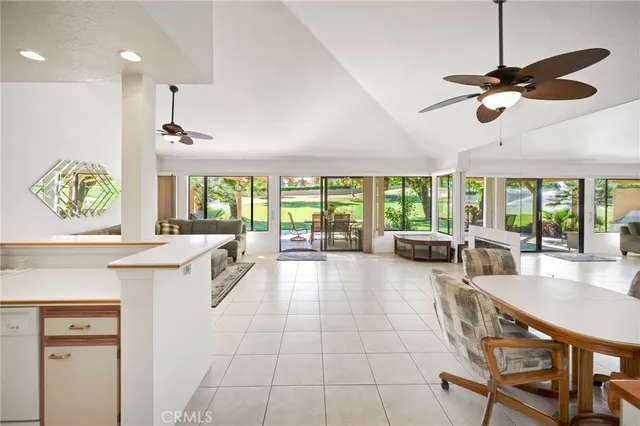 a large white kitchen with a large window
