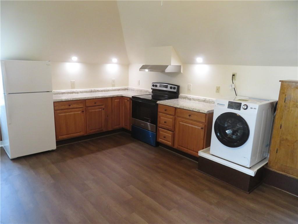 203 Main Street, Unit 3A Lyndora, PA 16045 - Photo 2 of 7 a utility room with wooden floor washer and dryer