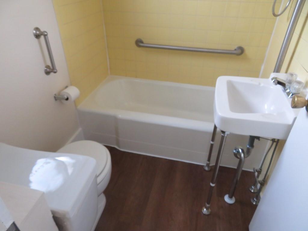 203 Main Street, Unit 3A Lyndora, PA 16045 - Photo 4 of 7 a bathroom with a sink and bathtub
