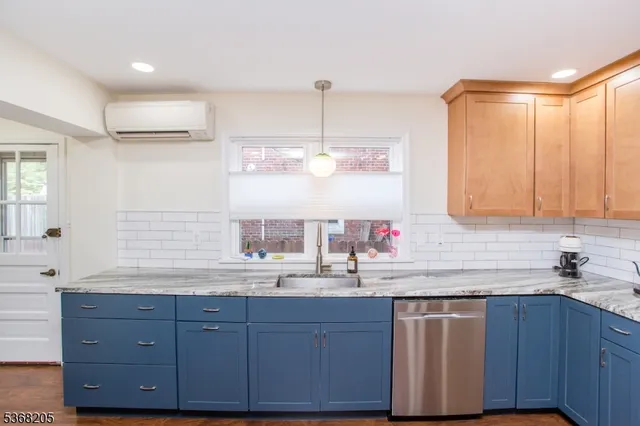 a kitchen with a sink and cabinets