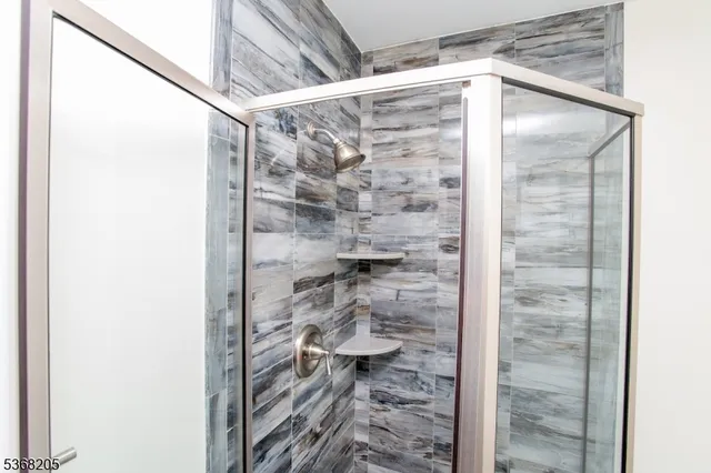 a bathroom with a sink mirror and toilet