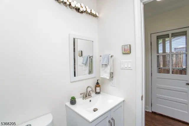 a utility room with sink dryer and washer