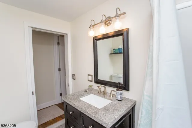 a bathroom with a shower and a tub