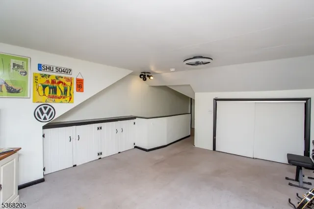 a view of a house with a porch and furniture