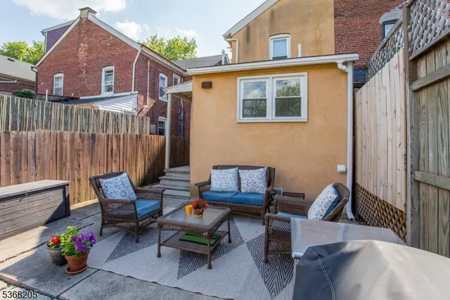 a backyard of a house with lots of green space and plants