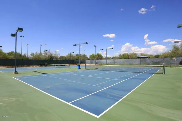 a view of an outdoor space and tennis court