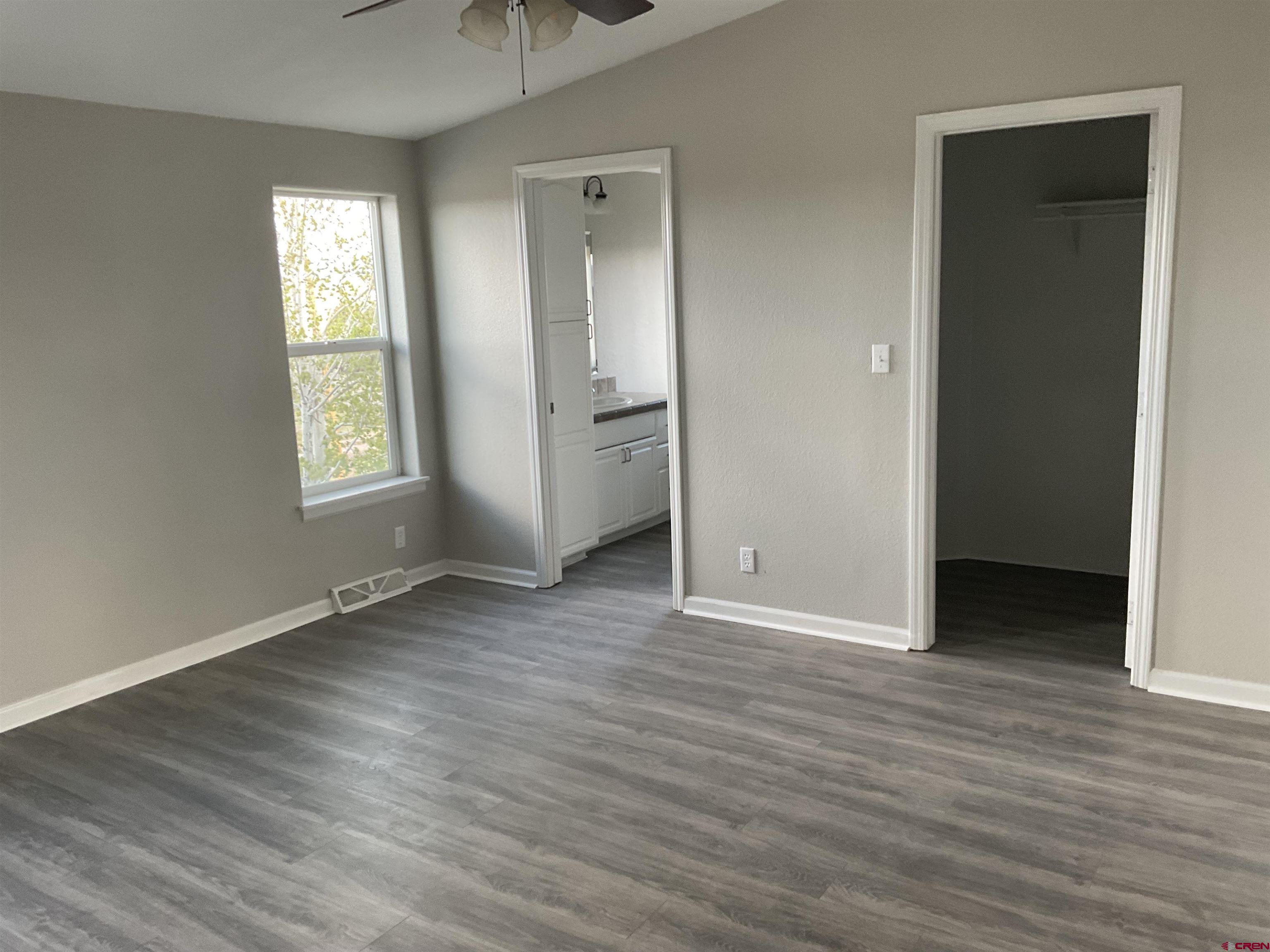 428 County Road 314 Ignacio, CO 81137 - Photo 19 of 24 an empty room with wooden floor and windows