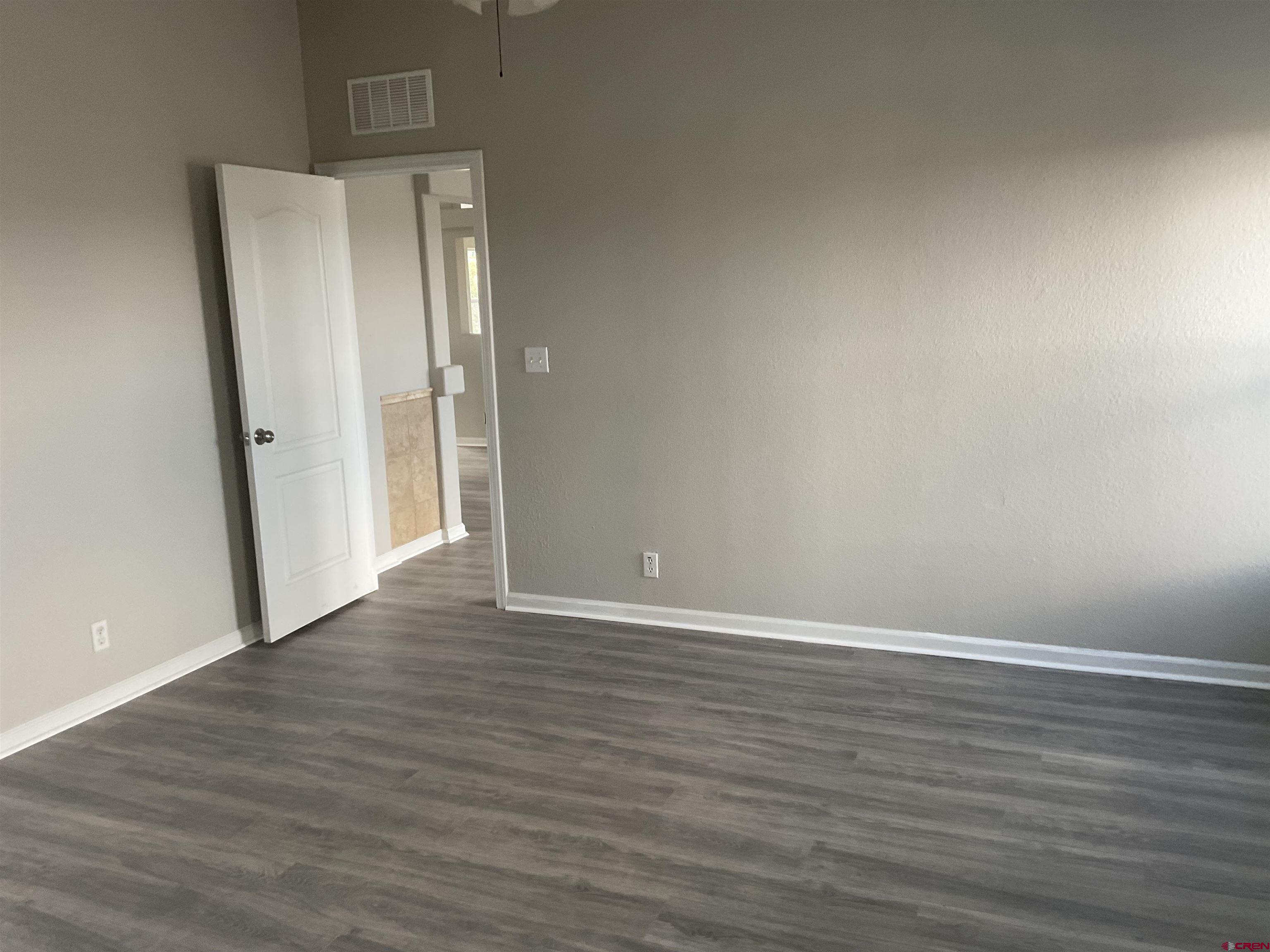 428 County Road 314 Ignacio, CO 81137 - Photo 20 of 24 a view of an empty room with wooden floor and a window