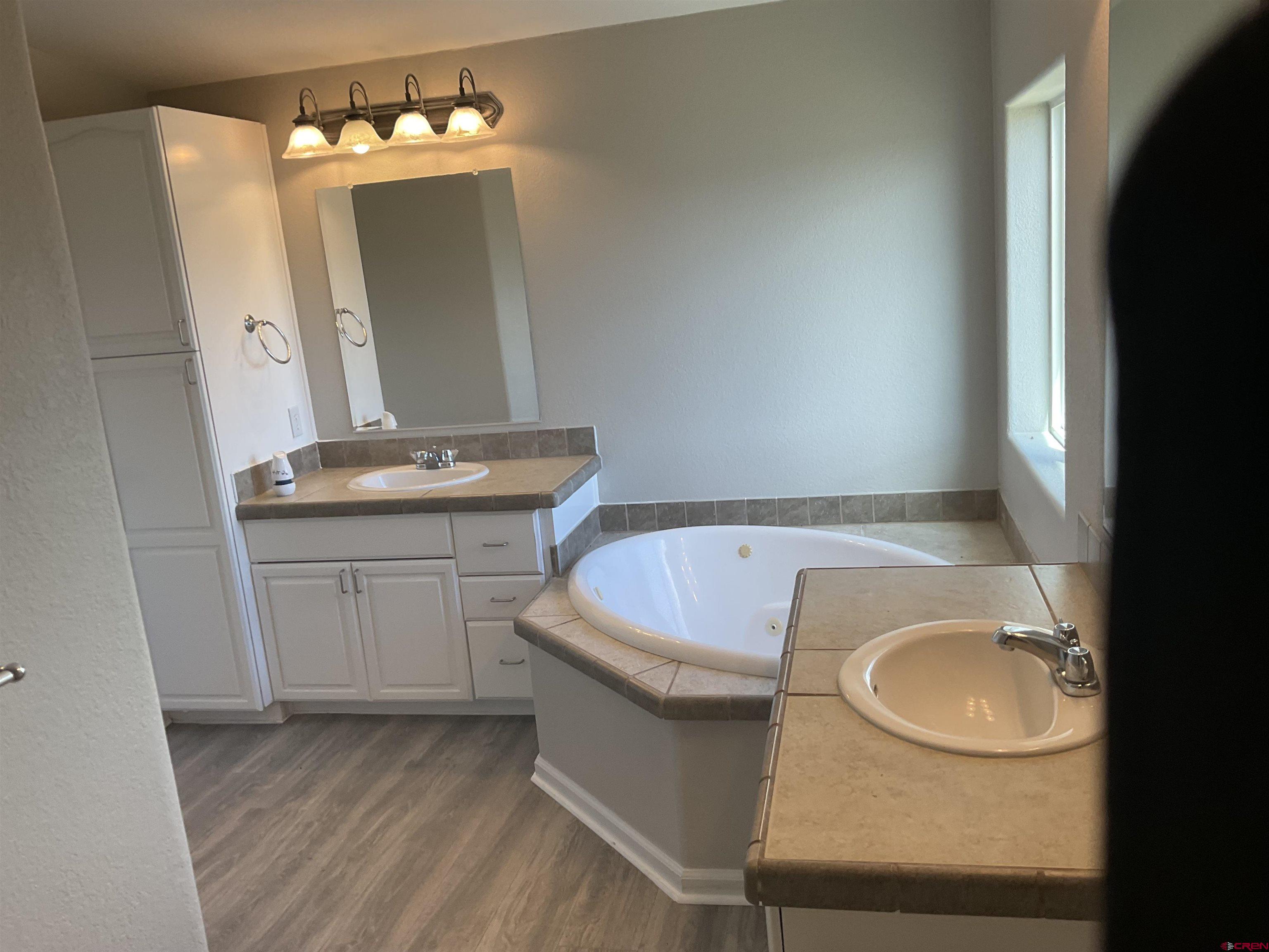 428 County Road 314 Ignacio, CO 81137 - Photo 23 of 24 a bathroom with a sink a toilet and mirror