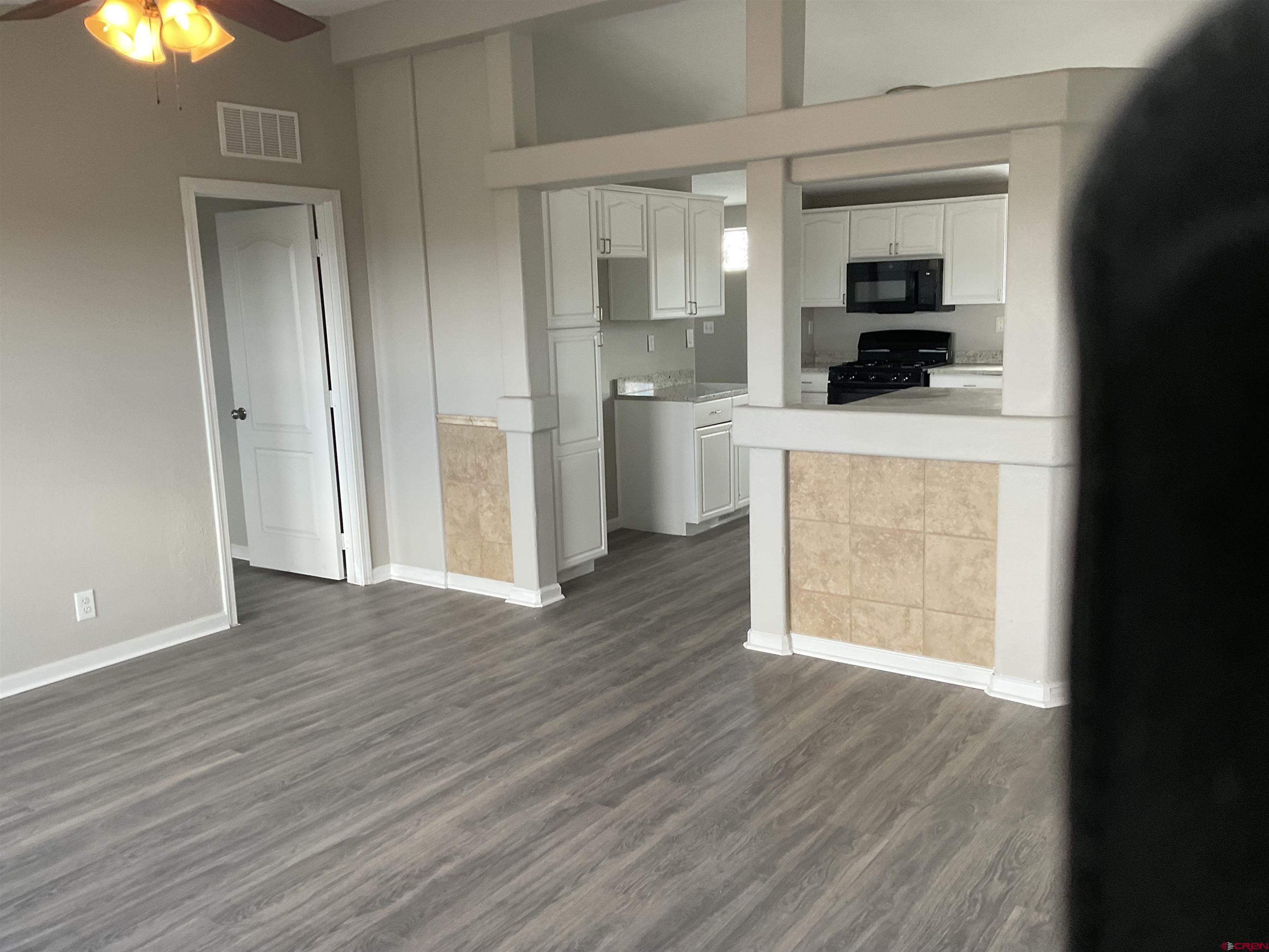 428 County Road 314 Ignacio, CO 81137 - Photo 5 of 24 a view of a kitchen from an empty room and fire place