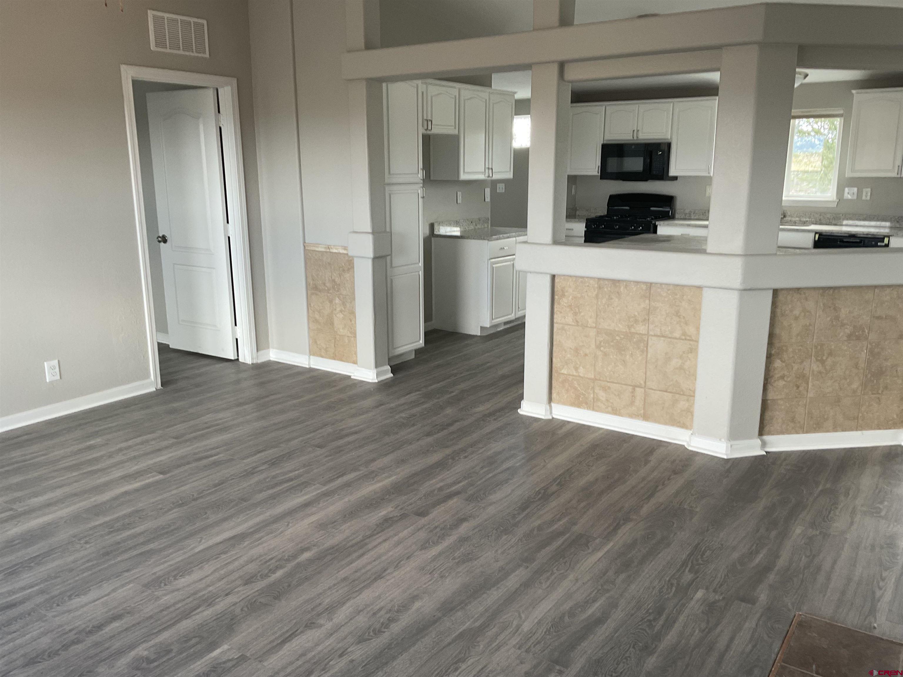 428 County Road 314 Ignacio, CO 81137 - Photo 6 of 24 a view of a kitchen cabinets and wooden floor