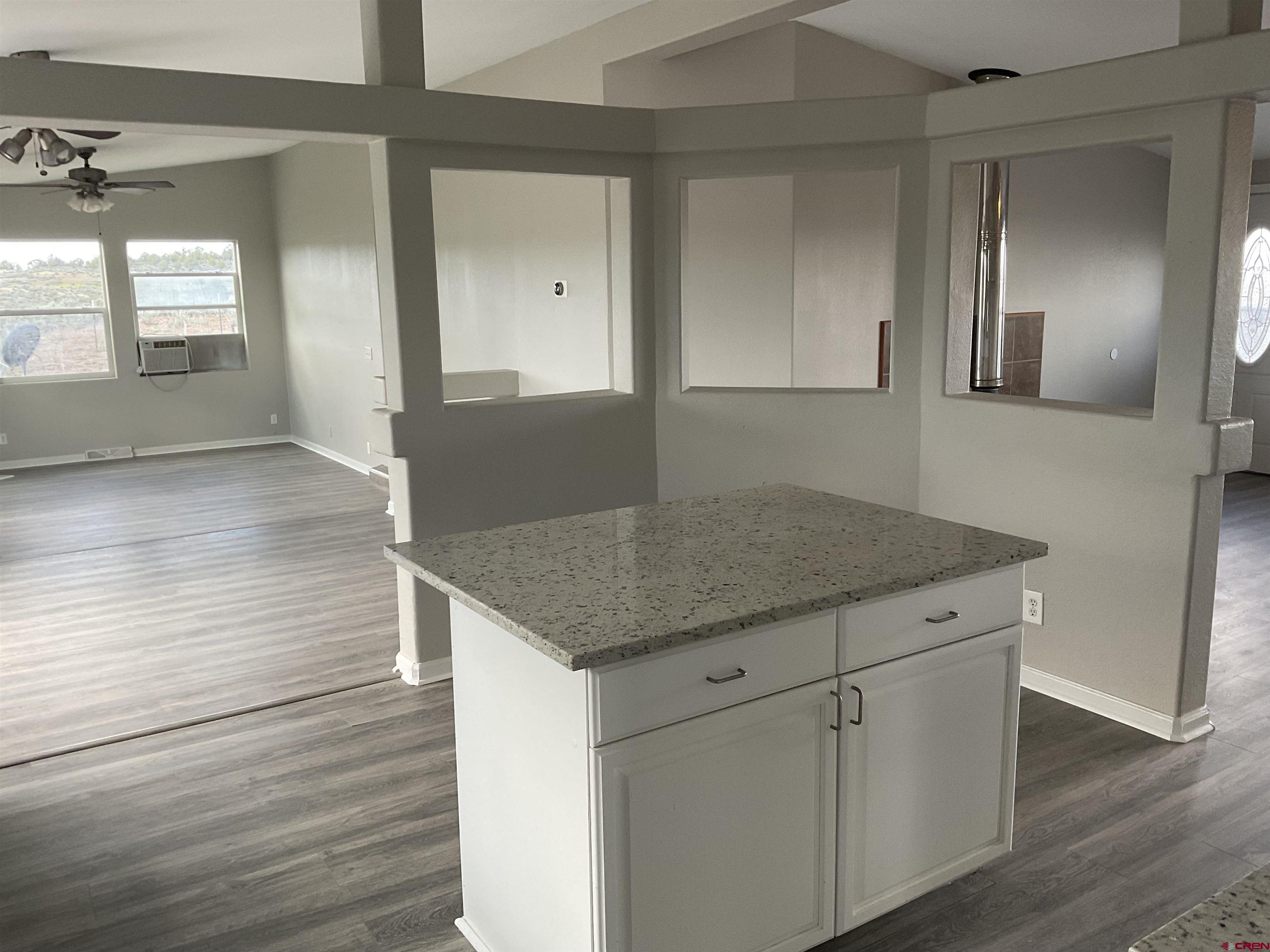 428 County Road 314 Ignacio, CO 81137 - Photo 9 of 24 a kitchen with granite countertop a sink and cabinets