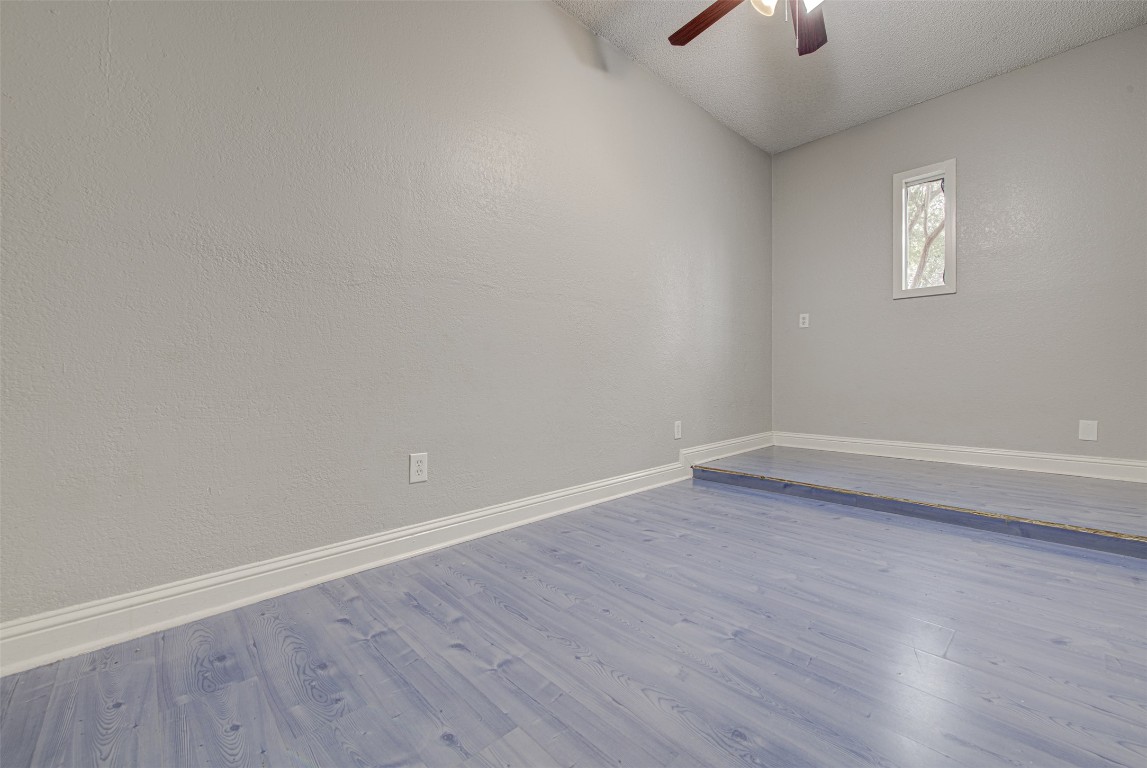 1401 Deepwoods Trail Leander, TX 78641 - Photo 11 of 34 wooden floor in an empty room with a window