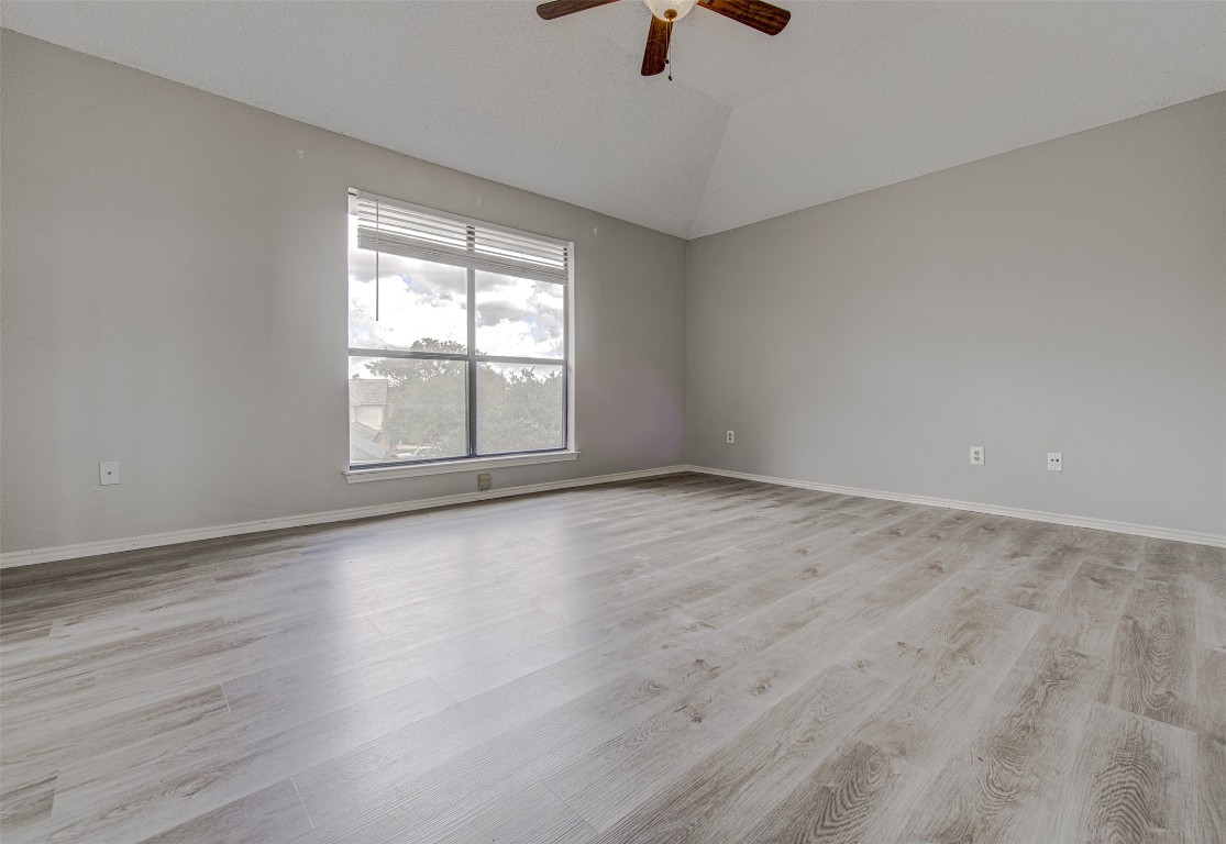 1401 Deepwoods Trail Leander, TX 78641 - Photo 15 of 34 wooden floor in an empty room with a window
