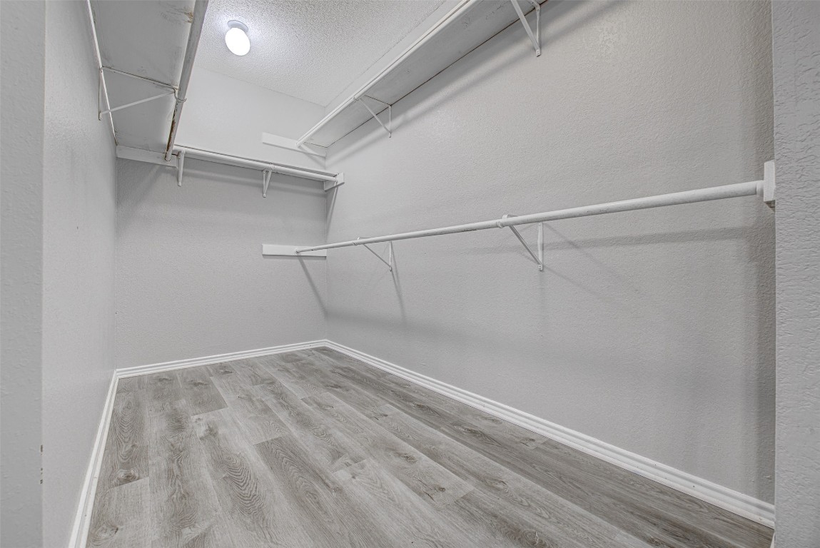 1401 Deepwoods Trail Leander, TX 78641 - Photo 19 of 34 a view of a room with racks on the wall