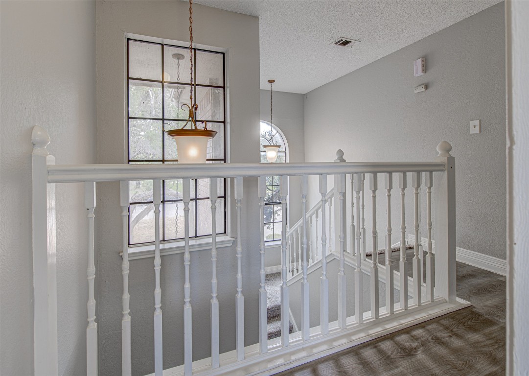 1401 Deepwoods Trail Leander, TX 78641 - Photo 22 of 34 a view of staircase with white walls and window
