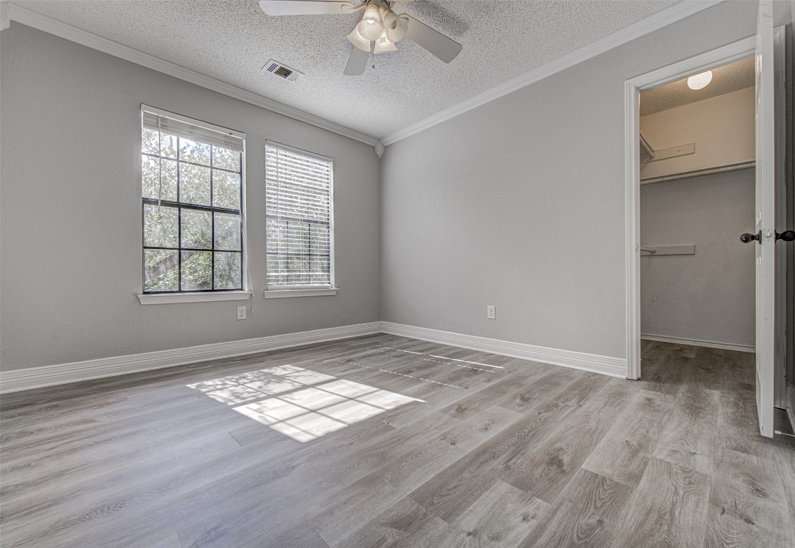 1401 Deepwoods Trail Leander, TX 78641 - Photo 23 of 34 wooden floor in an empty room with a window
