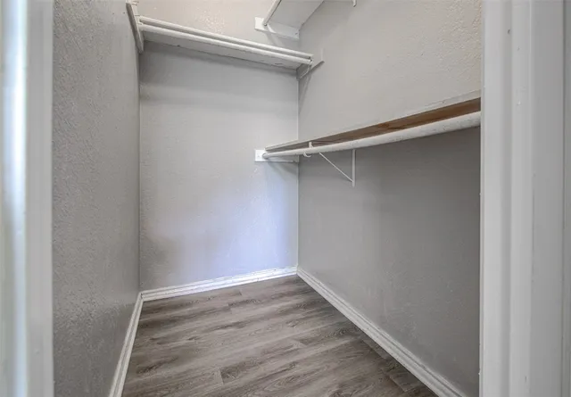 a view of an empty walk in closet